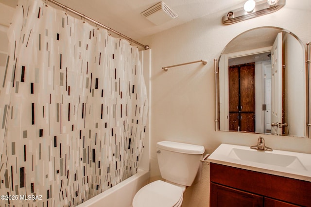 full bathroom with vanity, shower / bath combination with curtain, and toilet