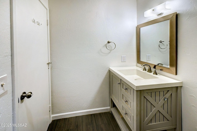 bathroom featuring vanity and wood-type flooring