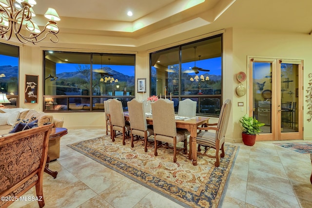 dining room featuring a mountain view and a notable chandelier