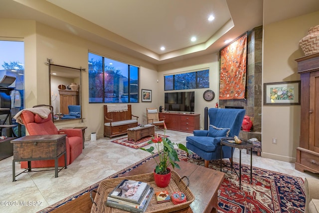 living room with a tray ceiling