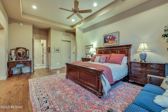 bedroom featuring ceiling fan and light hardwood / wood-style flooring