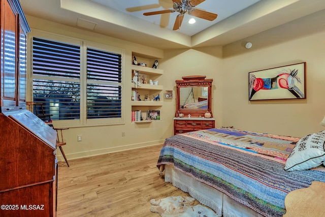 bedroom with ceiling fan and light wood-type flooring