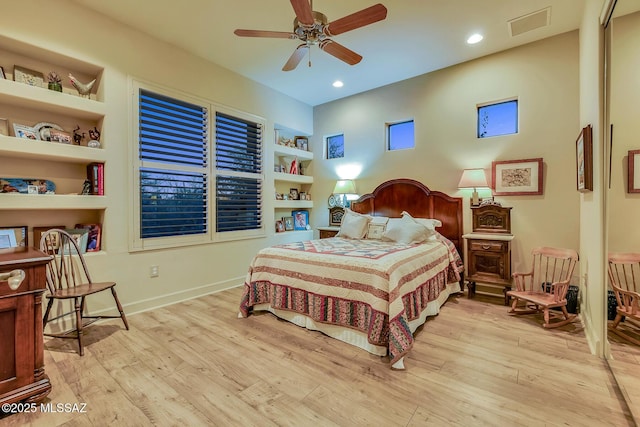 bedroom with ceiling fan and light hardwood / wood-style flooring