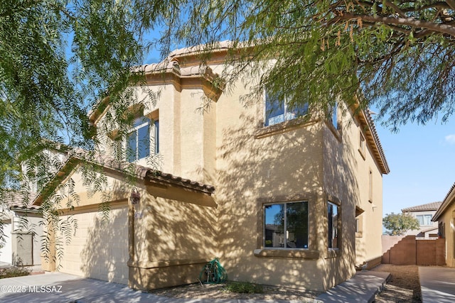 view of property exterior with a garage