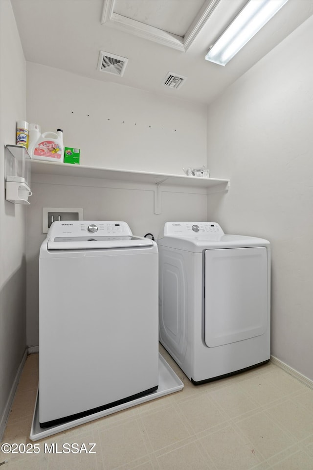 7585 E Majestic Palm Ln, Tucson, AZ 85756 - laundry area featuring separate washer and dryer and baseboards