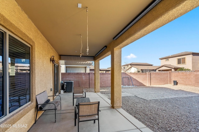 7585 E Majestic Palm Ln, Tucson, AZ 85756 - view of patio with a fenced backyard and cooling unit