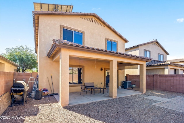 7585 E Majestic Palm Ln, Tucson, AZ 85756 - rear view of house with stucco siding, a fenced backyard, a patio area, and central AC