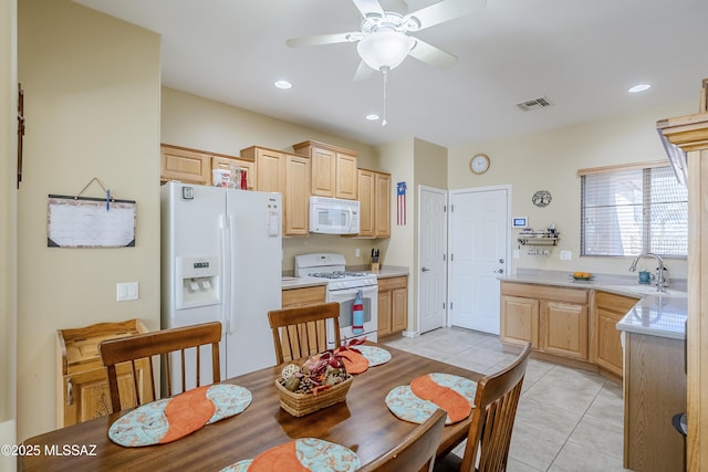 kitchen with light brown cabinets, white appliances, sink, ceiling fan, and light tile patterned floors