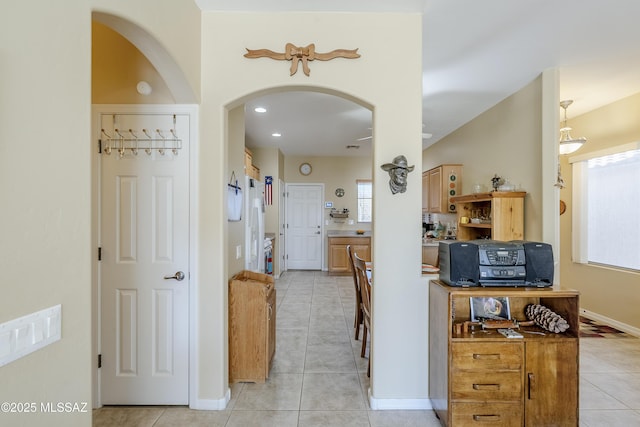 hallway with light tile patterned flooring