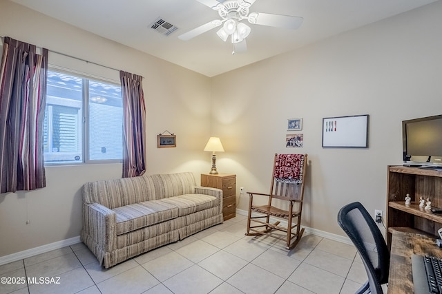 sitting room featuring light tile patterned floors, plenty of natural light, and ceiling fan