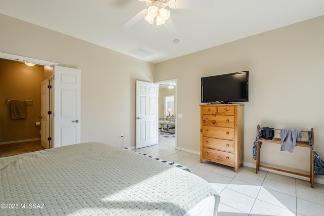 bedroom with ensuite bath, ceiling fan, and light tile patterned floors