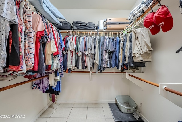 spacious closet featuring tile patterned floors