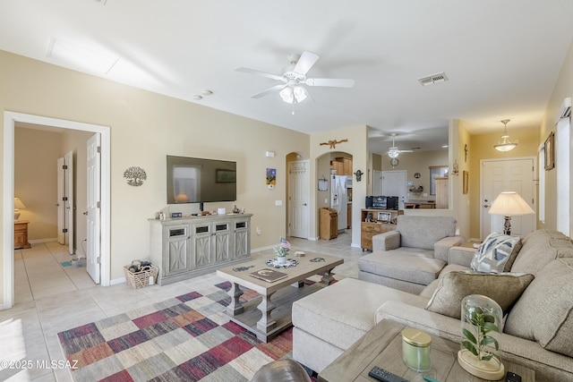 living room with ceiling fan and light tile patterned flooring