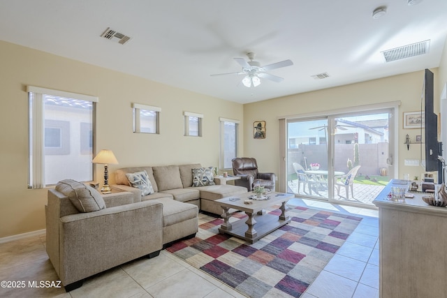 living room featuring ceiling fan and light tile patterned floors