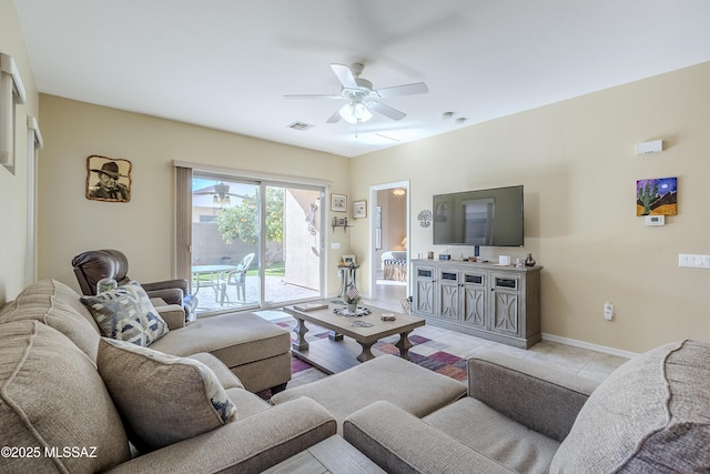 living room with light tile patterned floors and ceiling fan