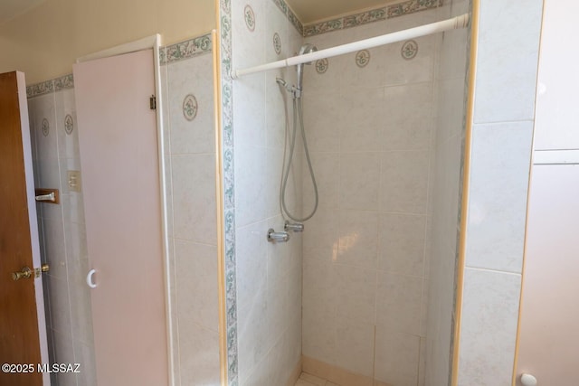 bathroom featuring an enclosed shower