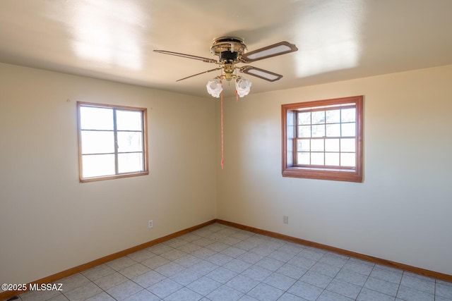 spare room with ceiling fan