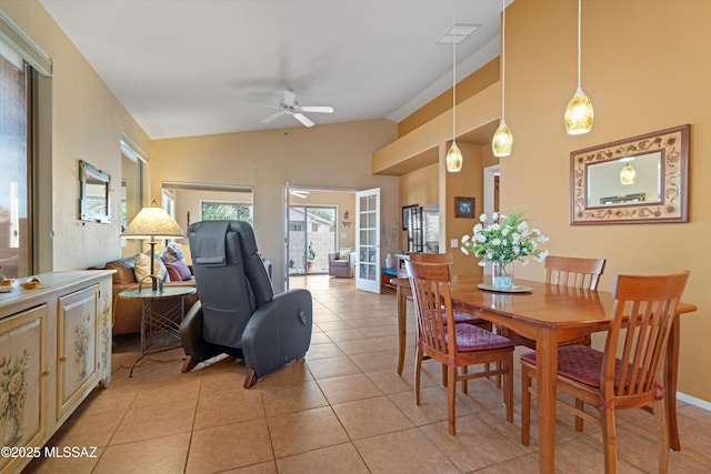 dining room with french doors, ceiling fan, vaulted ceiling, and light tile patterned floors