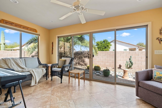 sunroom / solarium with ceiling fan