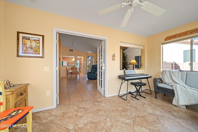 interior space featuring ceiling fan and vaulted ceiling