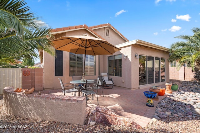 rear view of house featuring a patio area