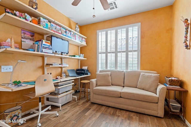 home office featuring hardwood / wood-style flooring and ceiling fan