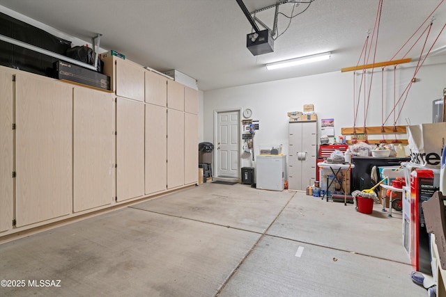 garage featuring a garage door opener and fridge