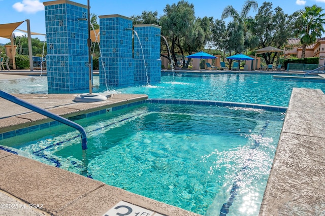 view of swimming pool featuring pool water feature