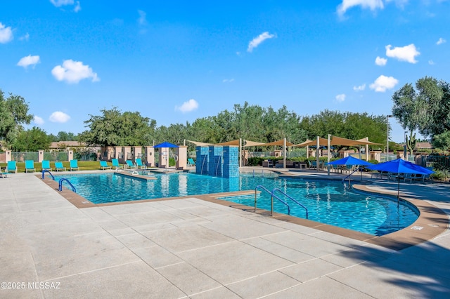 view of swimming pool with a patio