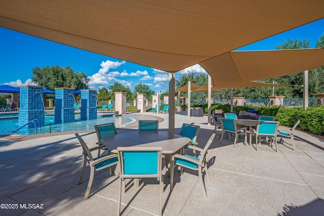 view of patio / terrace featuring pool water feature and a community pool