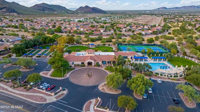 birds eye view of property with a mountain view