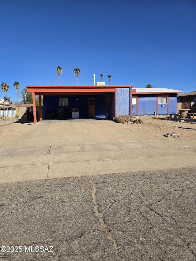 view of front of home featuring a carport