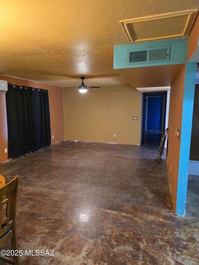 spare room with a textured ceiling