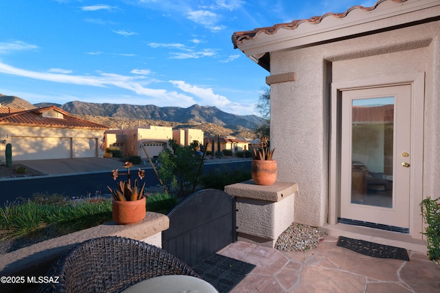 view of patio / terrace featuring a mountain view