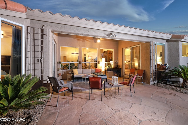 patio terrace at dusk with an outdoor hangout area