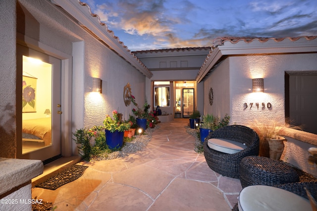 view of patio terrace at dusk