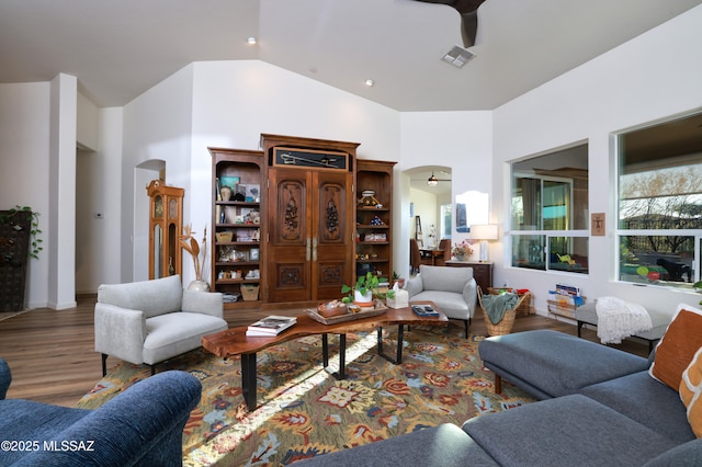 living room with ceiling fan and wood-type flooring