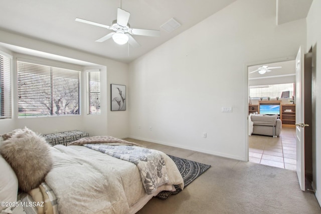 carpeted bedroom with lofted ceiling and ceiling fan