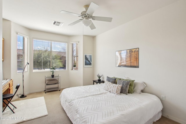 bedroom with light colored carpet and ceiling fan