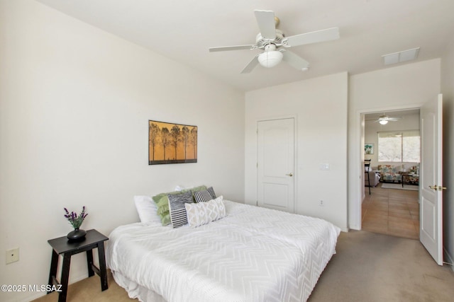 carpeted bedroom featuring ceiling fan