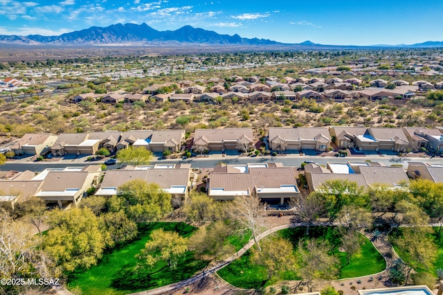 birds eye view of property with a mountain view