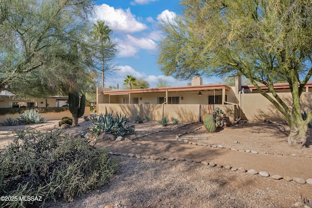 view of front of house featuring ceiling fan