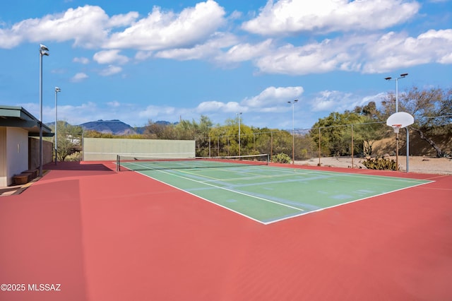 view of sport court featuring a mountain view and basketball court