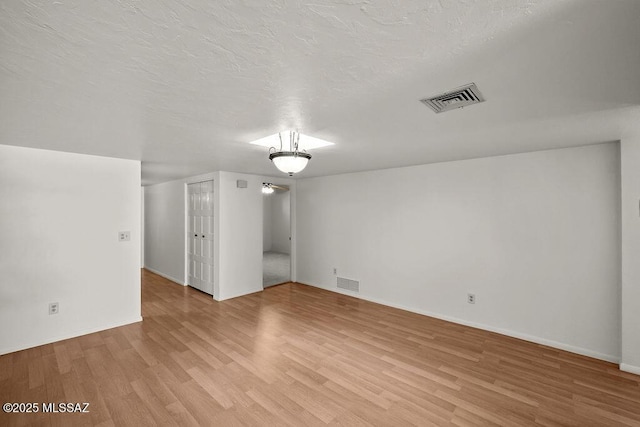 bonus room with light hardwood / wood-style flooring