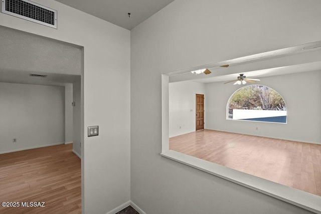 hallway featuring hardwood / wood-style floors