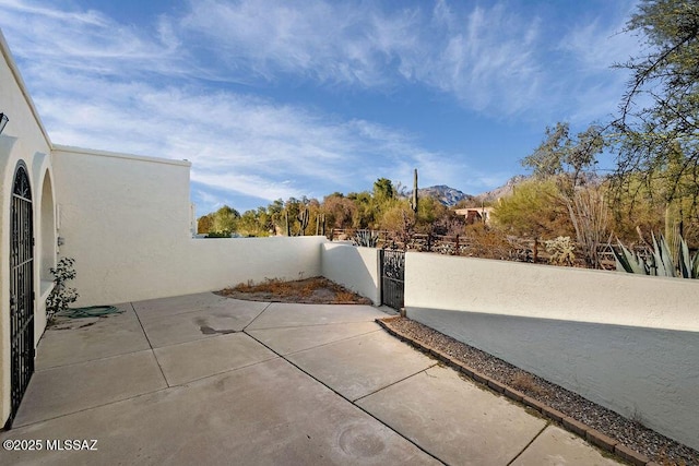 view of patio / terrace featuring a mountain view