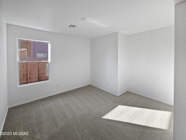 unfurnished room featuring carpet