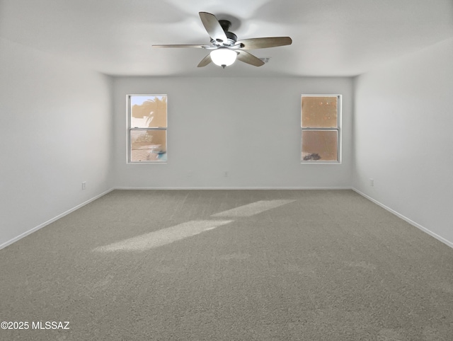 carpeted empty room with ceiling fan