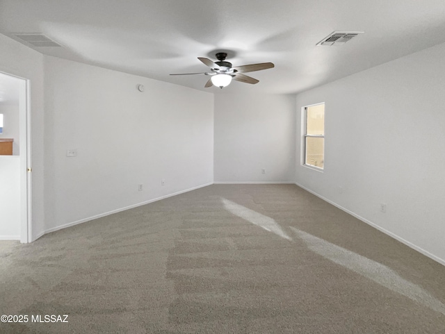 unfurnished room featuring carpet floors and ceiling fan