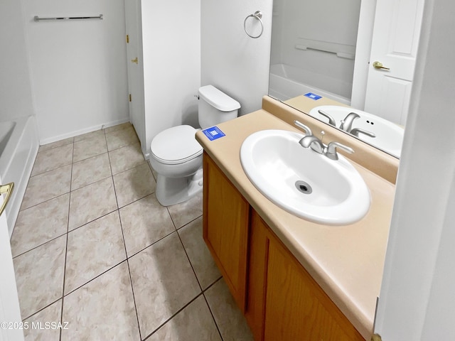 bathroom featuring tile patterned flooring, vanity, and toilet